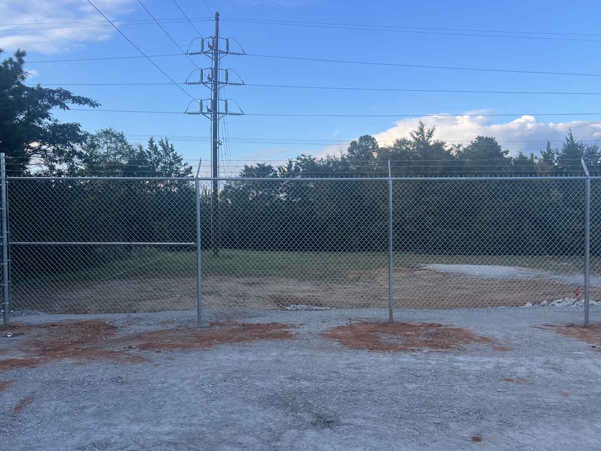 Fence with Galvanized Chain Link Fence Installation for Industrial Lot – Secure Property Boundary in Fort Worth, TX