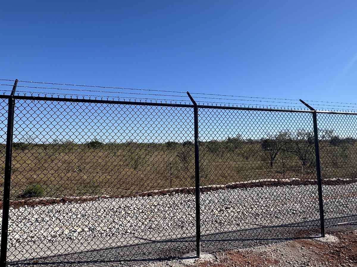 Fence with High-Security Black Chain Link Fence with Barbed Wire – Perimeter Fencing for Commercial Property in Fort Worth, TX