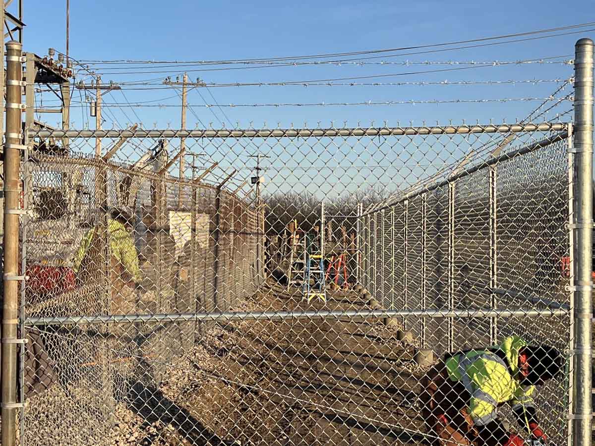 Fence with Utility Site Chain Link Fence with Barbed Wire – Electric Substation Security Fencing Installation in Fort Worth, TX