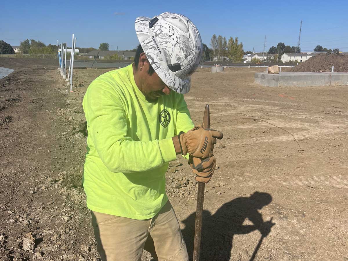 Fence with Fence Contractor Installing Ground Rod for Chain Link Fence – Commercial Job Site Preparation in Fort Worth, TX