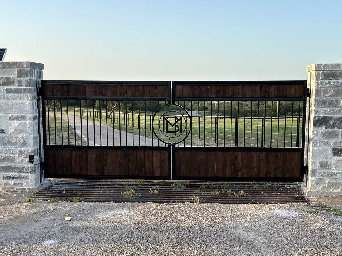 Fence with Finished Dual-Swing Wood and Iron Gate with Monogram | Fort Worth, Texas Fence Company in Fort Worth, TX