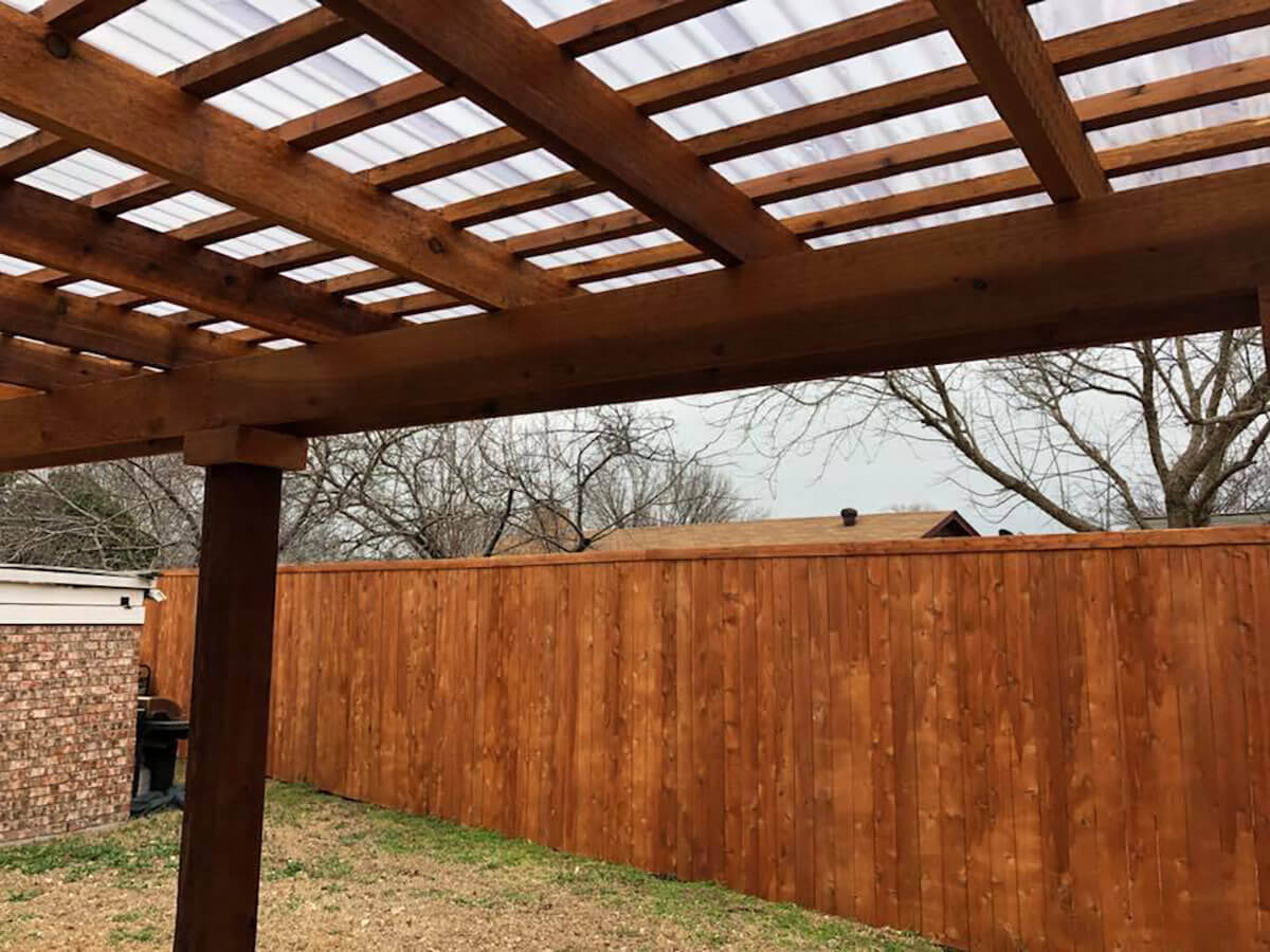 Fence with Wood pergola built in a residential backyard in Fort Worth TX in Fort Worth, TX
