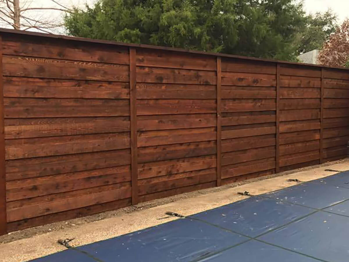 Fence with Fence staining company in Fort Worth TX for a horizontal board on board wood fence with a cap top in Fort Worth, TX
