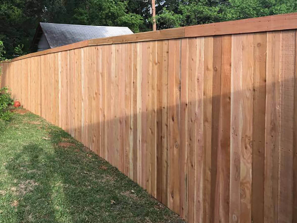 Fence with Full privacy wood fence with top trim installed around a backyard in Fort Worth TX in Fort Worth, TX