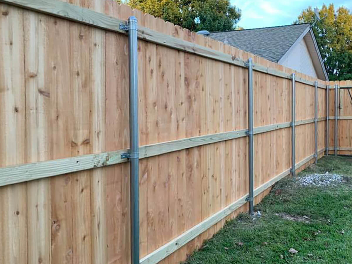 Fence with Stockade wood fence with metal posts installed in Fort Worth TX around a residential backyard in Fort Worth, TX