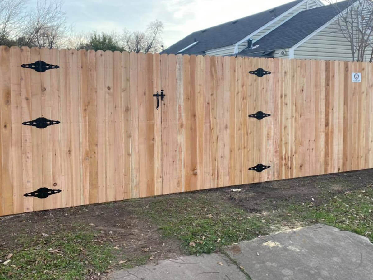Fence with Stockade wood fence and gate installed around a residential backyard in Fort Worth TX in Fort Worth, TX