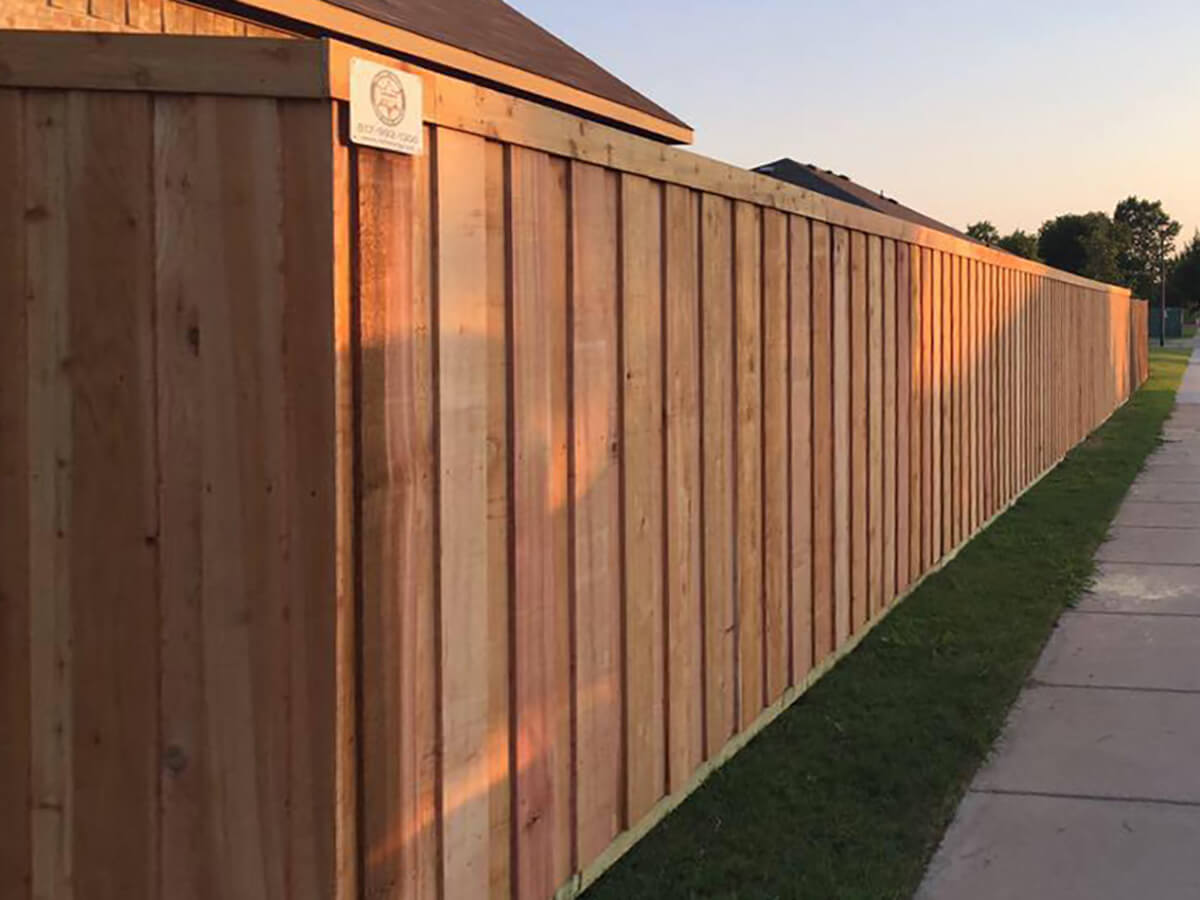 Fence with Board on board wood fence with trim installed around a residential home in Fort Worth TX in Fort Worth, TX