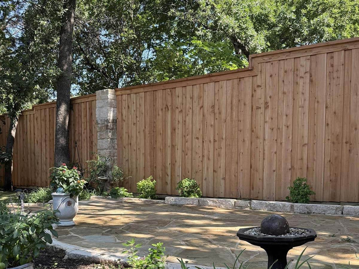 Fence with Board on board wood fence with cap and trim installed around a home in Fort Worth TX in Fort Worth, TX