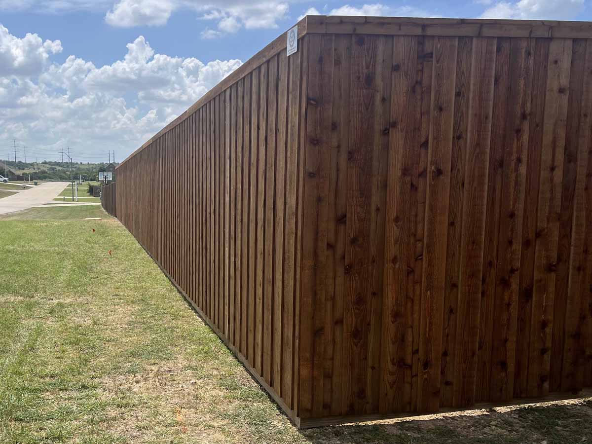 Fence with Board-on-Board Cedar Fence with Cap Trim – Privacy Fence Along Property Line in Fort Worth, TX